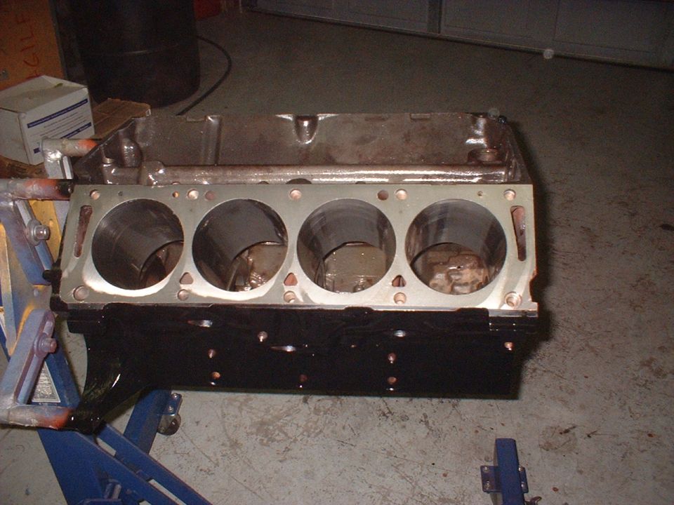 engine block on stand, cylinders visible