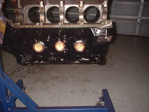1964 Ford Galaxie - An engine block is mounted on a stand, ready for assembly or inspection.