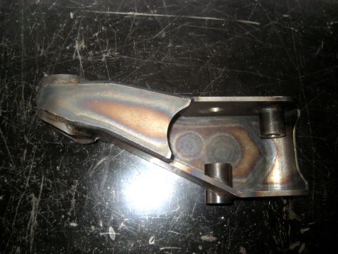 1996 Ford Bronco - Close-up of a custom metal bracket, likely a vehicle suspension component.