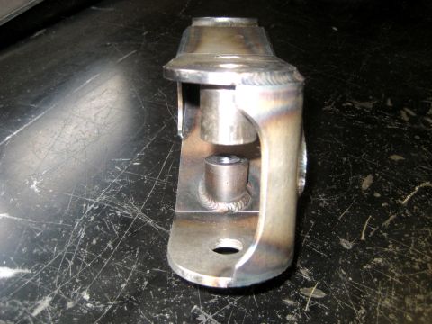1996 Ford Bronco - A close-up view of a custom-made metal bracket, showing its welded construction and mounting features.