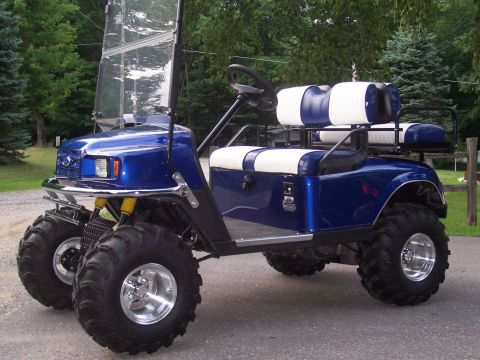 1978 Ford F-150 - This modified golf cart features a custom blue paint job, large off-road tires, and two-tone seating.