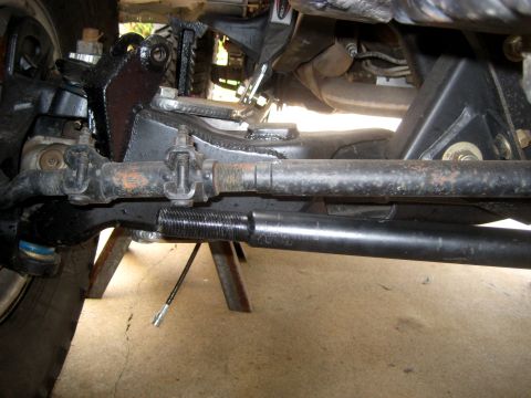 1996 Ford Bronco - Underside view of vehicle steering and suspension parts, showing wear and tear.