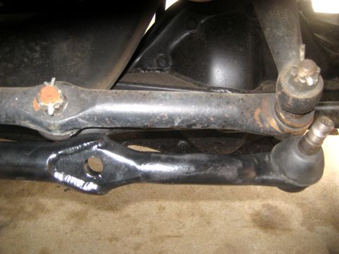 1996 Ford Bronco - Underside view of a vehicle's steering mechanism, showing tie rods and ball joints.