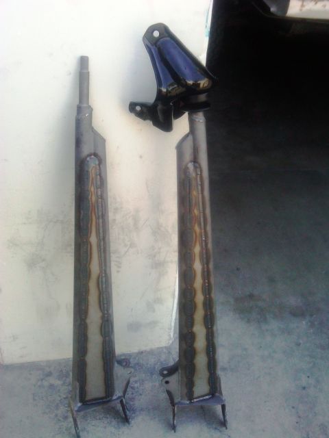 1986 Ford Bronco - Modified radius arms, likely for an off-road vehicle, showing custom welding work.