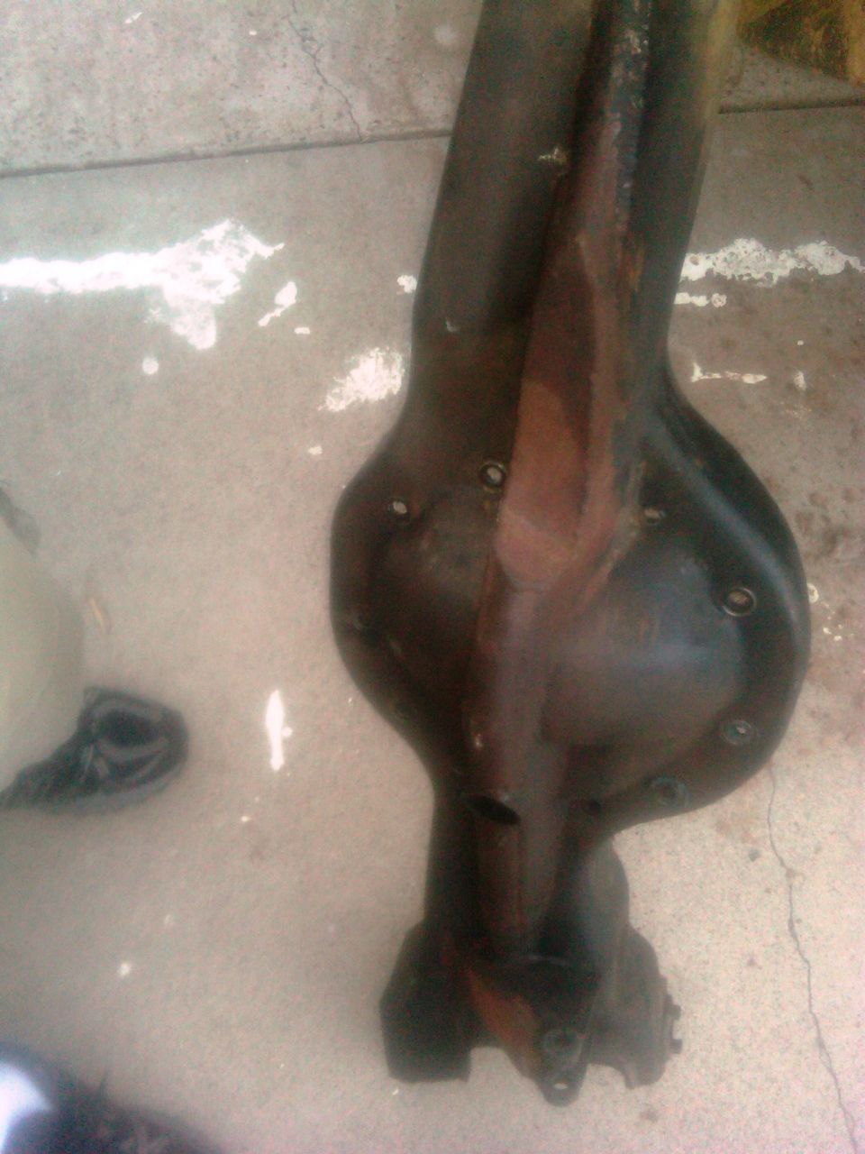 Rear axle differential part on concrete