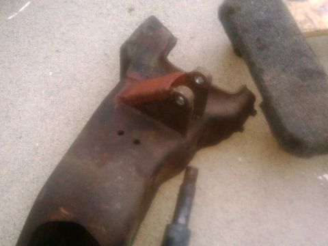 1986 Ford Bronco - A close-up of a corroded metal component, possibly from a vehicle's undercarriage.