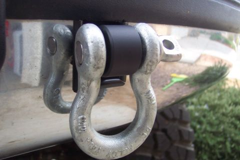 1995 Ford Bronco - Close-up of tow hooks mounted on a vehicle's rear bumper.