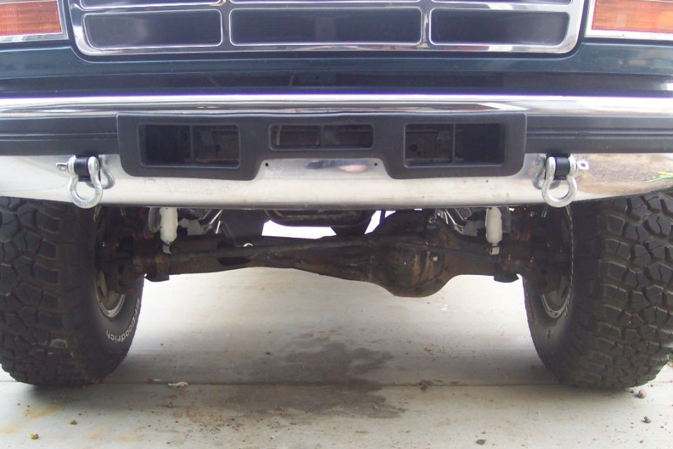 Front bumper, tow hooks, and front axle of a truck