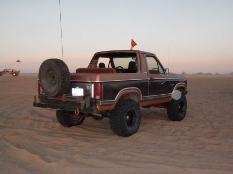 1982 Ford Bronco - This 1982 Ford Bronco is shown in a desert setting with a spare tire mounted on the rear.