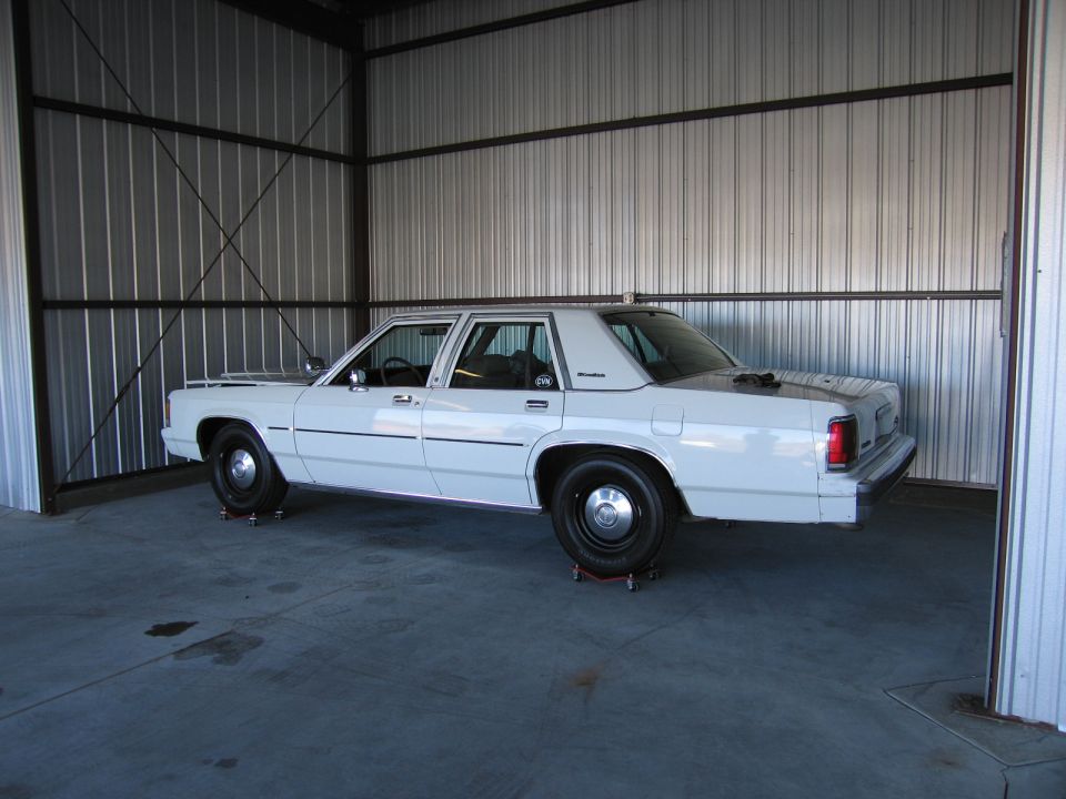 1991 Ford Crown Victoria LTD parked inside a metal structure