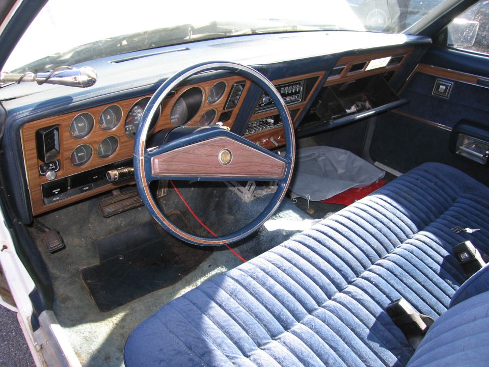 Blue velour interior with wood-grain dash and steering wheel