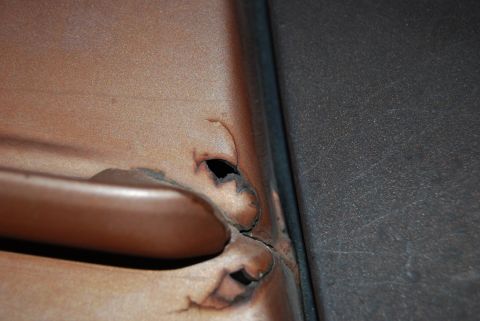 1982 Ford Bronco - The area around the door handle shows significant rust and damage.