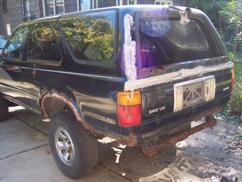 2006 Chevrolet Corvette - This 1989 Toyota 4Runner SR5 V6 shows significant rust damage on its body panels and rear bumper.
