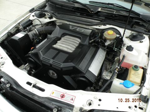 1995 Audi A6 - Close-up view of the engine bay, focusing on the V6 engine cover with Audi branding.