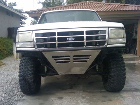 1995 Ford Bronco - Front view of a 1995 Ford Bronco modified with an aftermarket bumper and off-road tires.