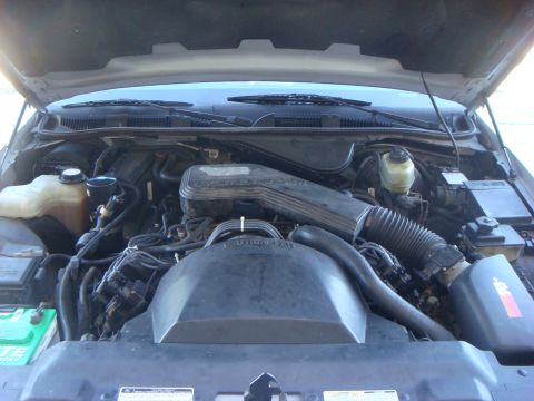 1994 Mercury Grand Marquis - The engine compartment of a 1994 Mercury Grand Marquis is shown with the hood open.