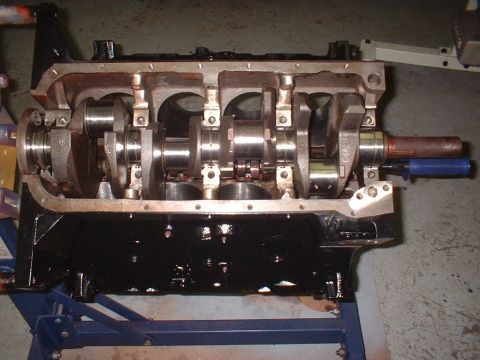 1964 Ford Galaxie - Close-up of an engine block assembly, showing internal components and a crankshaft.