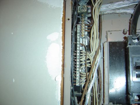 1986 Ford Bronco - Close-up view of the wiring inside an electrical panel, showing bus bars and various cables.