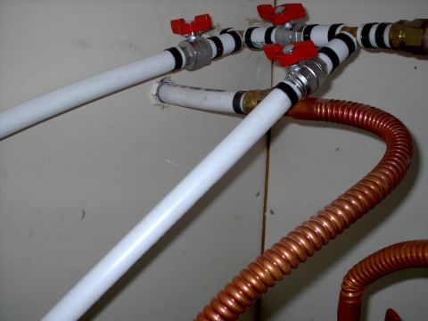1965 Ford Mustang - A close-up view of plumbing pipes and valves, with a Supermotors.net watermark visible.