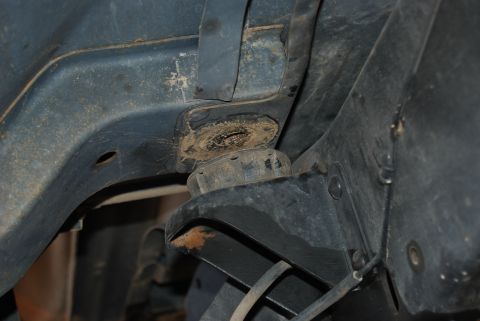 1982 Ford Bronco - Underside view of vehicle frame and suspension components, showing mounting hardware.