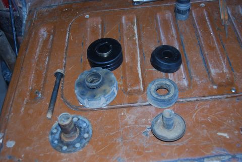 1982 Ford Bronco - Various suspension components are displayed on a textured surface, suggesting a repair or upgrade.