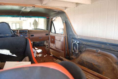 1982 Ford Bronco - Interior view of a 1982 Ford Bronco, revealing the dashboard, seats, and door panels.