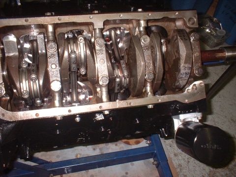 1964 Ford Galaxie - Close-up view of engine internals, showing crankshaft and connecting rods. Oil filter is attached.