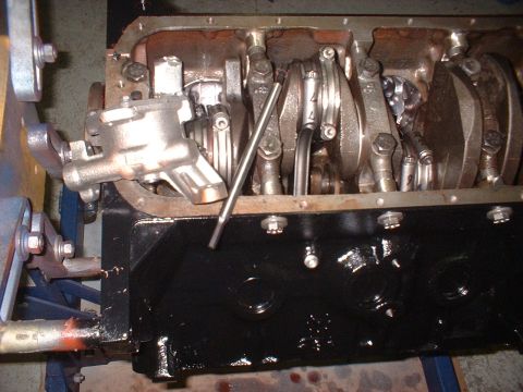 1964 Ford Galaxie - Close-up view of an engine block's internal components, including the crankshaft and oil pump.