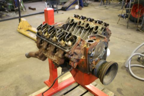 1973 Ford Ranchero - This V8 engine is mounted on a red stand, with its valve covers and exhaust manifold visible.