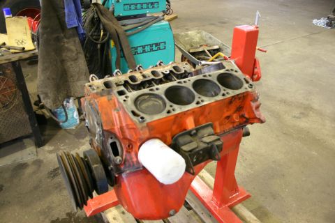 1973 Ford Ranchero - Engine block on a stand, likely in a workshop or garage setting.