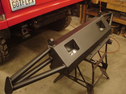 1989 Ford Bronco - A custom-fabricated rear bumper is shown, integrated light mounts and a robust tubular design.