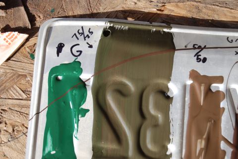 1982 Ford Bronco - A license plate is used as a surface for paint color testing, with handwritten notes indicating color proportions.