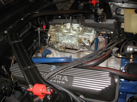 1968 Shelby GT500 - Close-up of a Ford Cobra engine, a Holley carburetor and ribbed valve covers.