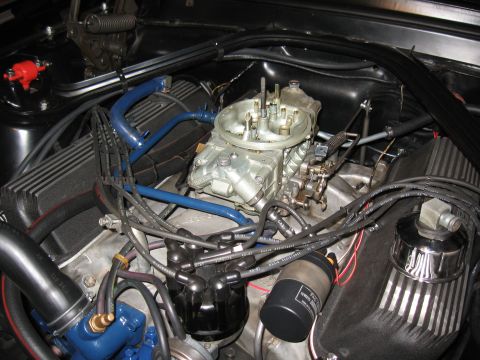1968 Shelby GT500 - Engine bay details including the carburetor, distributor, and spark plug wires.