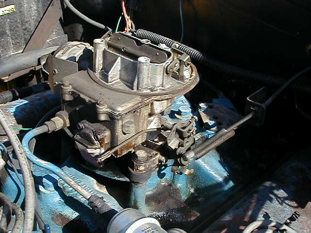 old carb on the jeep....POS.  Replaced with a new motorcraft that was rebuilt by holley.  Dont have a good pic of the new one yet
