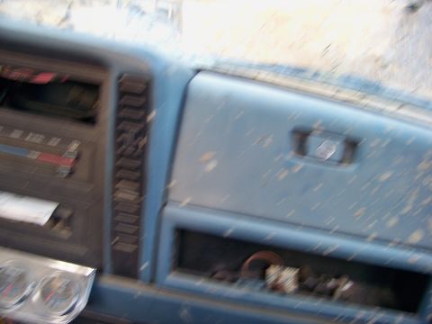 1987 Ford F-250 - Interior view of a 1987 Ford F-250 dashboard with radio and glove compartment.