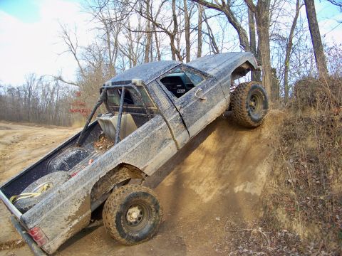 1987 Ford F-250 - This Jeep Comanche is equipped for off-road adventures, with large tires and a protective roll cage.