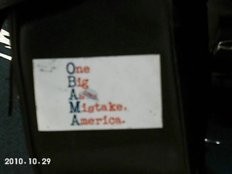 1996 Harley-Davidson Super Glide - A sticker with a political message is affixed to a dark, possibly upholstered surface.