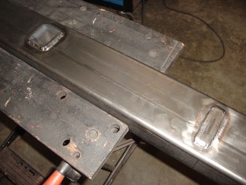 1989 Ford Bronco - A metal frame piece, possibly a bumper or chassis component, is shown with visible welds and mounting points.