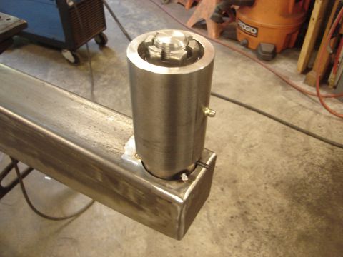 1989 Ford Bronco - A close-up view of a metal component, possibly a part of a larger assembly, a prominent nut and bolt mechanism.