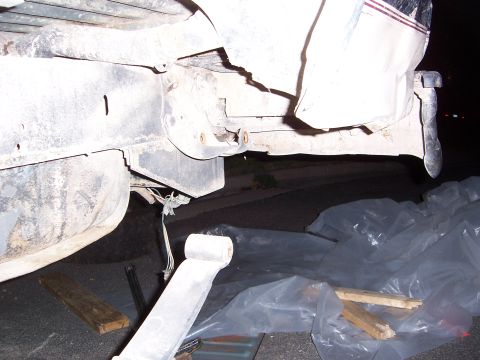 1992 Ford Bronco - Close-up of a vehicle's rear bumper and frame, showing some exposed wiring.