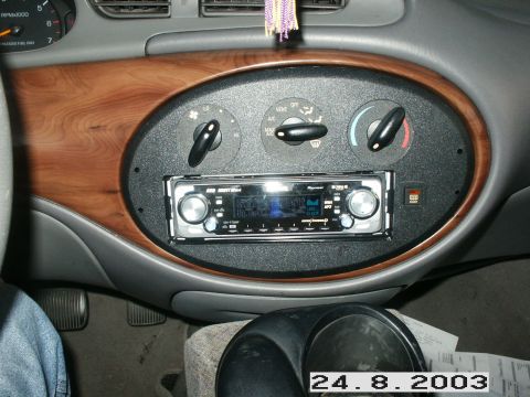 1998 Mercury Sable - Interior view of a 1998 Mercury Sable, highlighting the dashboard with an aftermarket Pioneer stereo and wood grain trim.