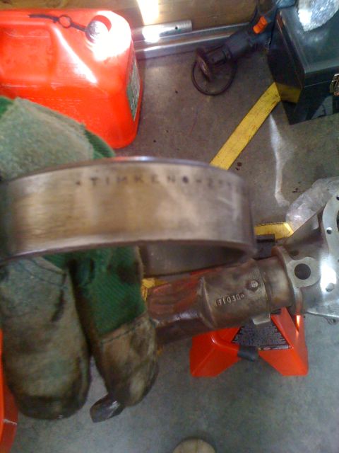 1992 Ford Bronco - Close-up of a Timken bearing and differential housing, likely for automotive repair.