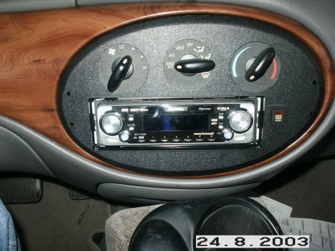 1998 Mercury Sable - Aftermarket Pioneer stereo installed in a car's dashboard, with climate controls above.