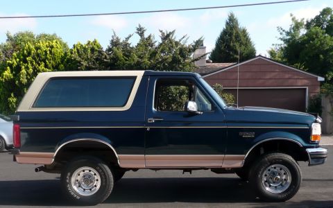 1995 Ford Bronco - This 1995 Ford Bronco is shown in a side profile, its distinctive two-tone paint scheme.