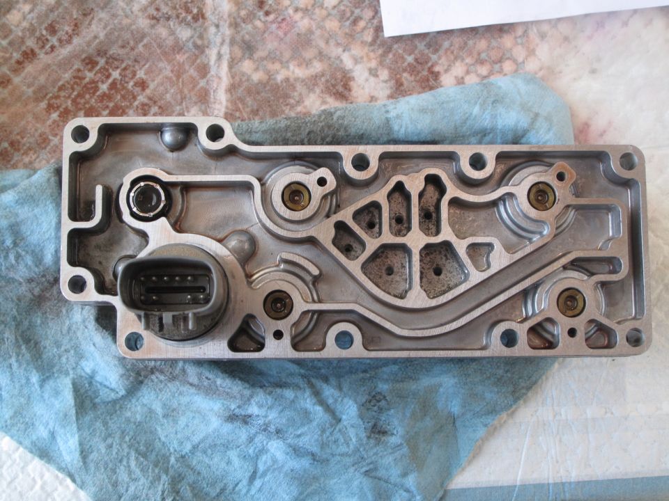 Transmission valve body with electrical connector and internal passages
