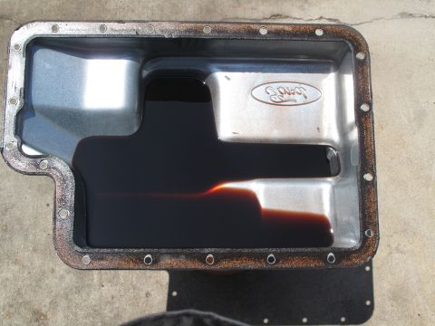 1995 Ford Bronco - Transmission pan shows dark fluid, indicating potential wear or maintenance needs.