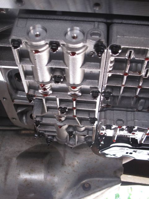 1995 Ford Bronco - This photo shows a close-up view of a transmission valve body, likely during maintenance or repair.