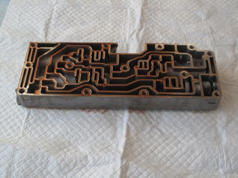 1995 Ford Bronco - This is a transmission valve body, a complex component with many internal passages for fluid control.