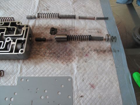 1995 Ford Bronco - Transmission valve body components disassembled for upgrade or repair.